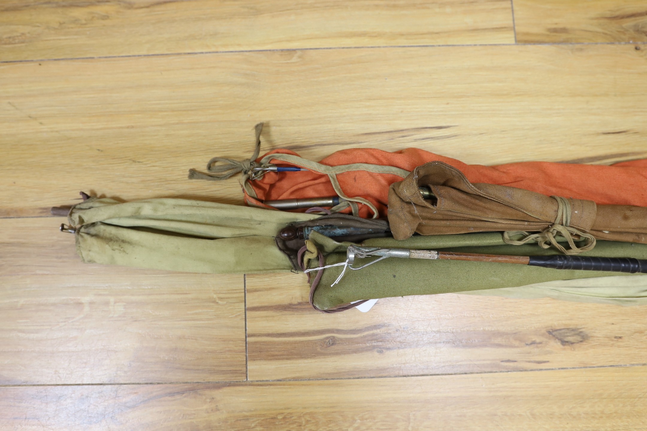 A quantity of fishing rods in fabric sleeves (6)
